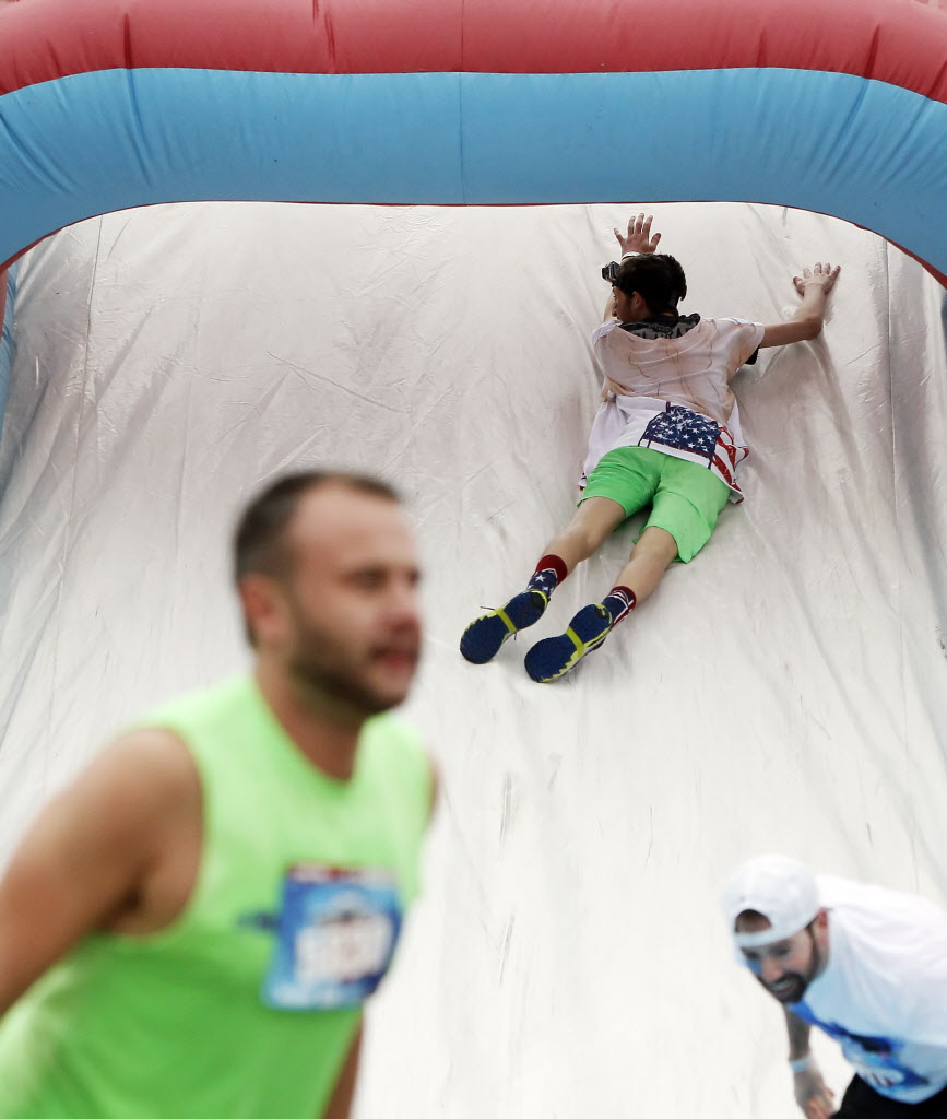 See the foamy, faceplanting fun of DFW's Wipeout Run GuideLive