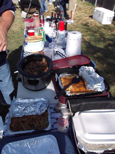 Rowdy Horn checks the turkey he is deep frying for Thanksgiving dinner  during pre-game tailgating for the Dallas Cowboys-Seattle Seahawks game  November 27, 2008 at Texas Stadium in Irving, Texas. Since 1978